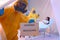 Paramedic holding sign with words WARNING BIOHAZARD in quarantine ward