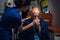 Paramedic pressing an oxygen mask to an injured man`s face