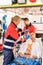 Paramedic putting oxygen mask on patient ambulance