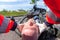 Paramedic removes an helmet from an injured biker