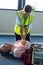 Paramedic using an external defibrillator during cardiopulmonary resuscitation