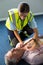 Paramedic using an external defibrillator during cardiopulmonary resuscitation