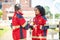 Paramedical personnel dressed in red uniforms standing outdoors