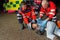 Paramedics helping motorbike driver lying on road