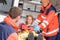 Paramedics helping woman in ambulance broken arm