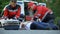 Paramedics making injection male feeling chest pain and lying on road, first aid