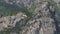 Paramotor Flying. Parachutist with the motor flies against the backdrop of the mountains