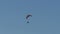 Paramotor high in the blue sky