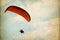 Paramotor over sky with clouds