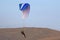 Paramotor pilot landing in the hills of Wales