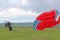 Paramotor pilot launching in a field