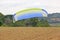 Paramotor trike launching in a field