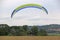 Paramotor trike launching in a field