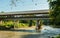 Paranhana river and a view of the covered bridge - a historical landmark in Tres Coroas, Brazil