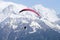 Parapenter flying over french snowy Mont Blanc massif