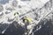 Parapenters flying over french snowy Mont Blanc massif