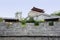 Parapet of ancient Chinese wall with gate tower on mountaintop