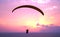 Paraplane shiluete on sunset