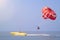 Parasailing - active form of recreation, in which person is fixed with long rope to moving boat and thanks to presence of special