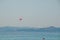 Parasailing at Beach in Europe, extreme Sport. Tourists parasailing, popular entertainment for holiday travelers on sea