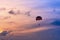 Parasailing in blue sky. Sports, active leisure, travel, vacation concept