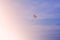 Parasailing in blue sky on sunny day