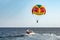 Parasailing colorful parachute motorboat