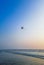 Parasailing extreme sports on beach in blue sky background.