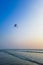 Parasailing extreme sports on beach in blue sky background.