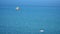 Parasailing. Extreme Water Sport in the Sea. Flying with Parachute Behind a Boat