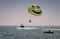 Parasailing: flying over the sea by parachute