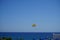 Parasailing in the Mediterranean. Parasailing is a recreational kiting activity where a person is towed behind a vehicle. Rhodes