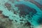 Parasailing over tropical sea, bright colors