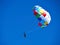 Parasailing popular vacation activity in summer resorts