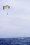 Parasailing in summer beach by speed boat, vertical composition