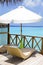 Parasol and chaise lounges on verandah of water vi