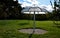 Parasol in the park made of metal and plastic polycarbonate material. the shape of an umbrella from it rains water. Water flows do