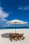 Parasol and sunbeds on the beach Atoll island Maldives