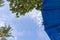 Parasol and trees against blue sky