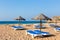 Parasols and beach beds at coast