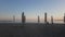 Parasols on the evening beach. View of the Mediterranean Sea and sunset from the shore