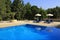 Parasols by the pool Porto Carras Meliton.