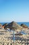 Parasols and sun loungers on the beach