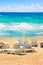 Parasols and sun loungers on beach. Ionian Sea , Peloponnese, Greece