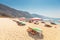 Parasols and sunbeds on a popular public beach in Olu deniz resort town