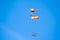 Paratrooper in full flight with the flag of Spain and a helicopter in the background