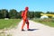 A paratrooper in a red suit goes on a plane for a jump