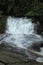 Paraty/Rio de Janeiro/Brazil - Pedra Branca waterfall, touristic place. Cold water runs through the rocks