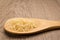 Parboiled Chinese Rice seed. Grains in wooden spoon. Rustic.