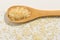 Parboiled Chinese Rice seed. Healthy grains on a wooden spoon. W